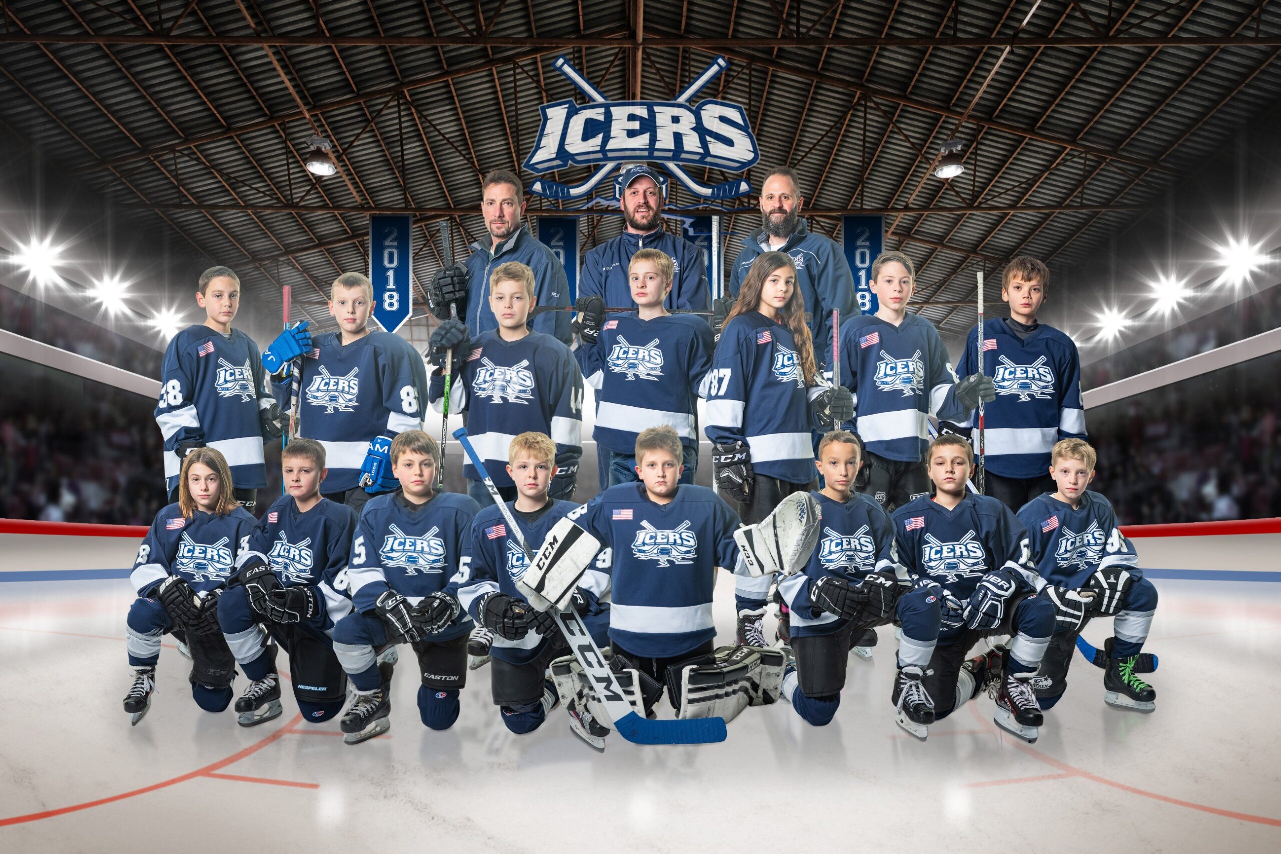 Ice hockey team posing on rink
