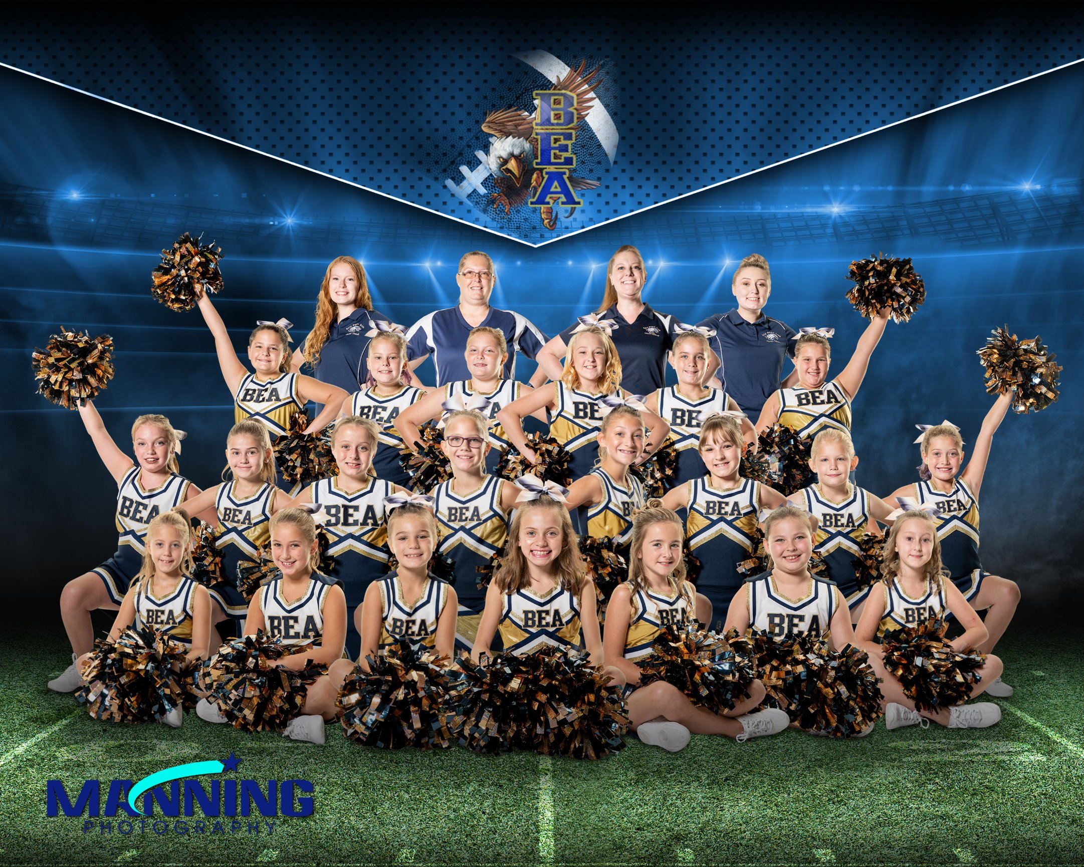 Group of cheerleaders smiling with pom-poms