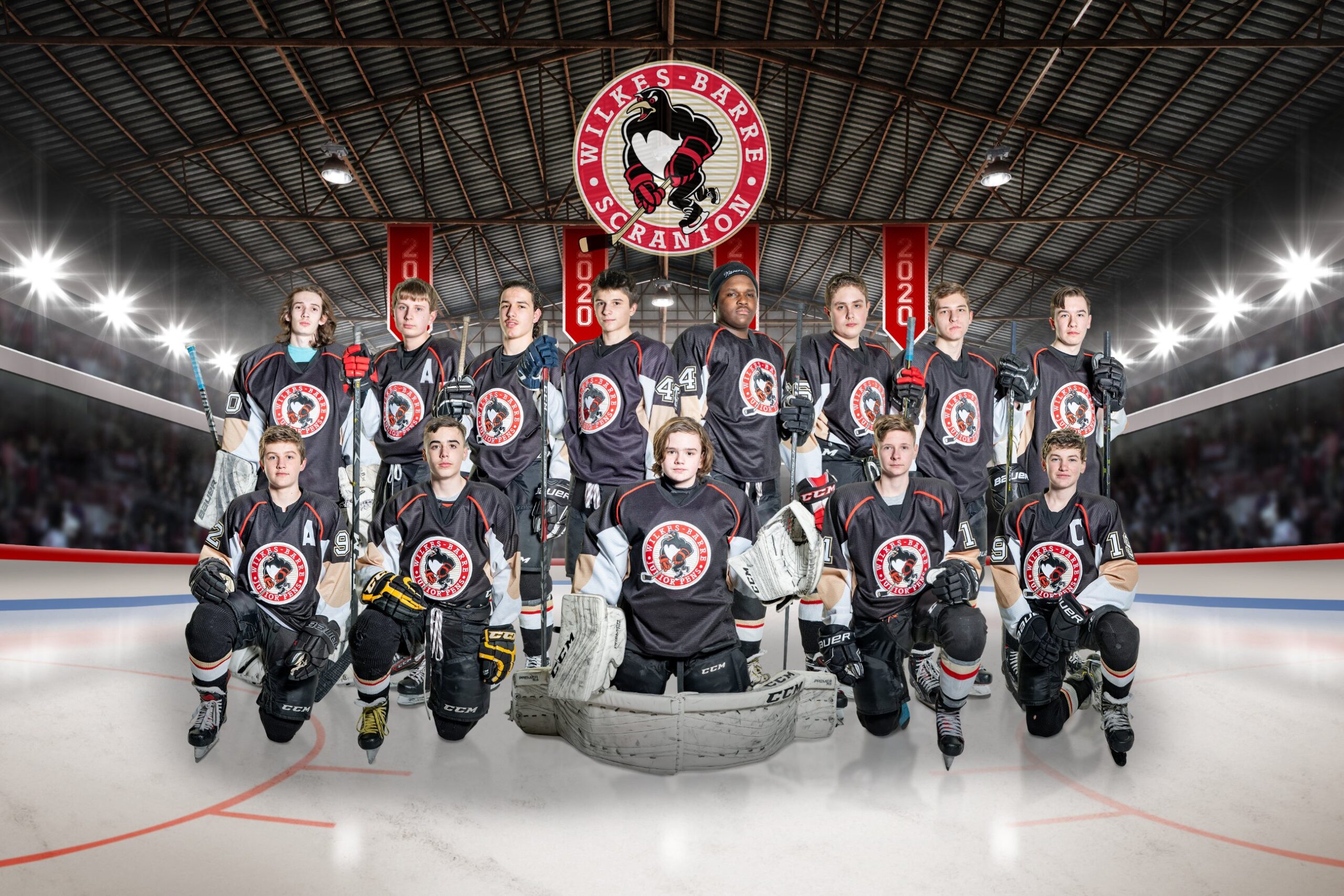 Hockey team posing on ice rink