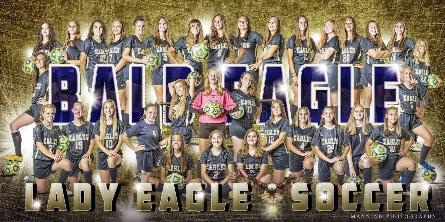 Female soccer players posing