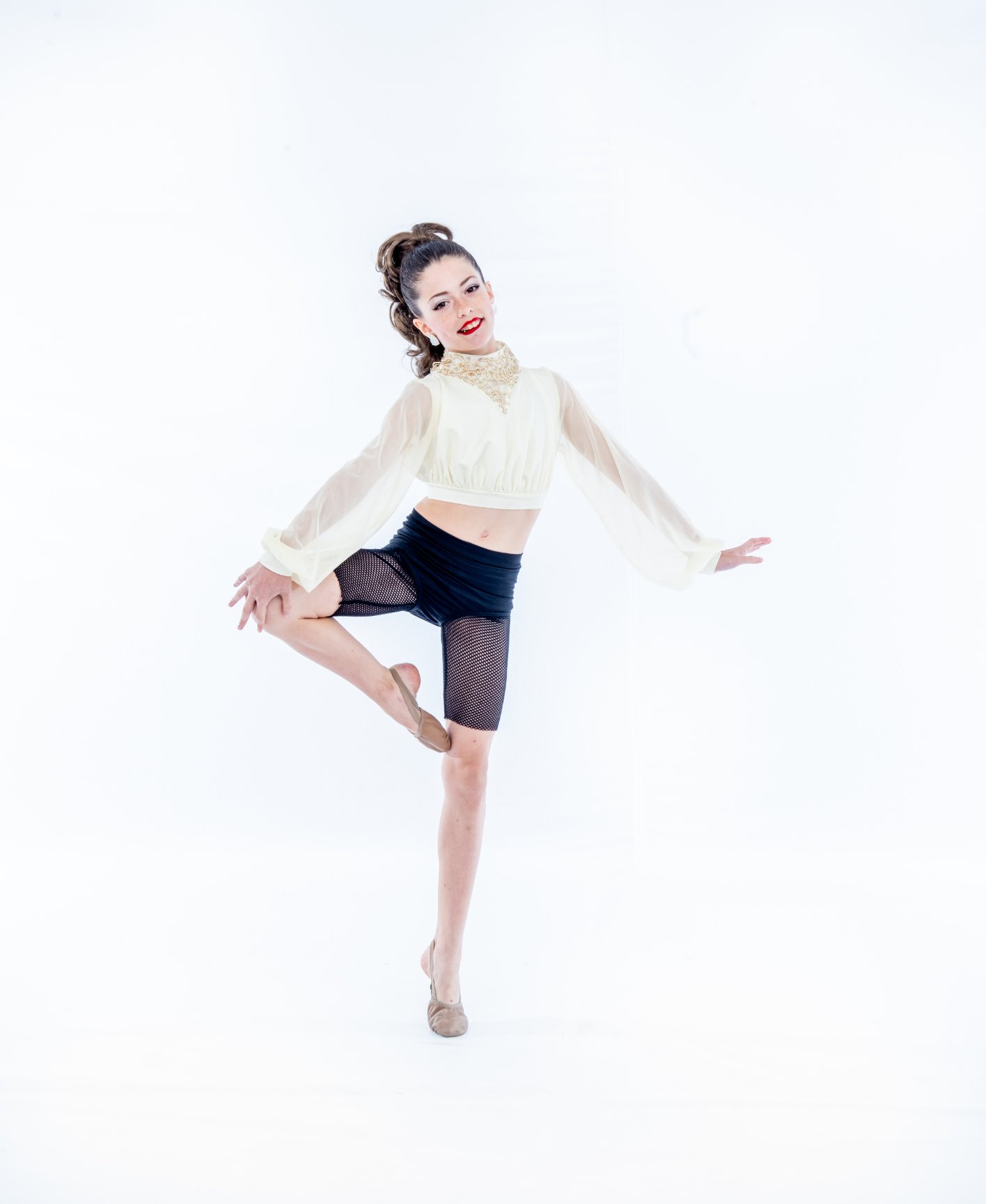 Dancer posing gracefully in studio