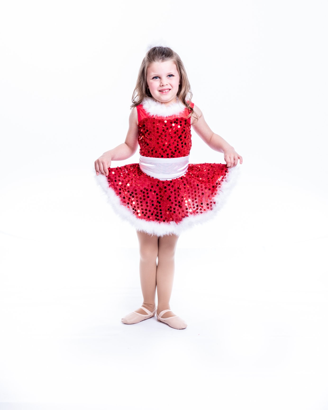 Little girl posing in festive dress