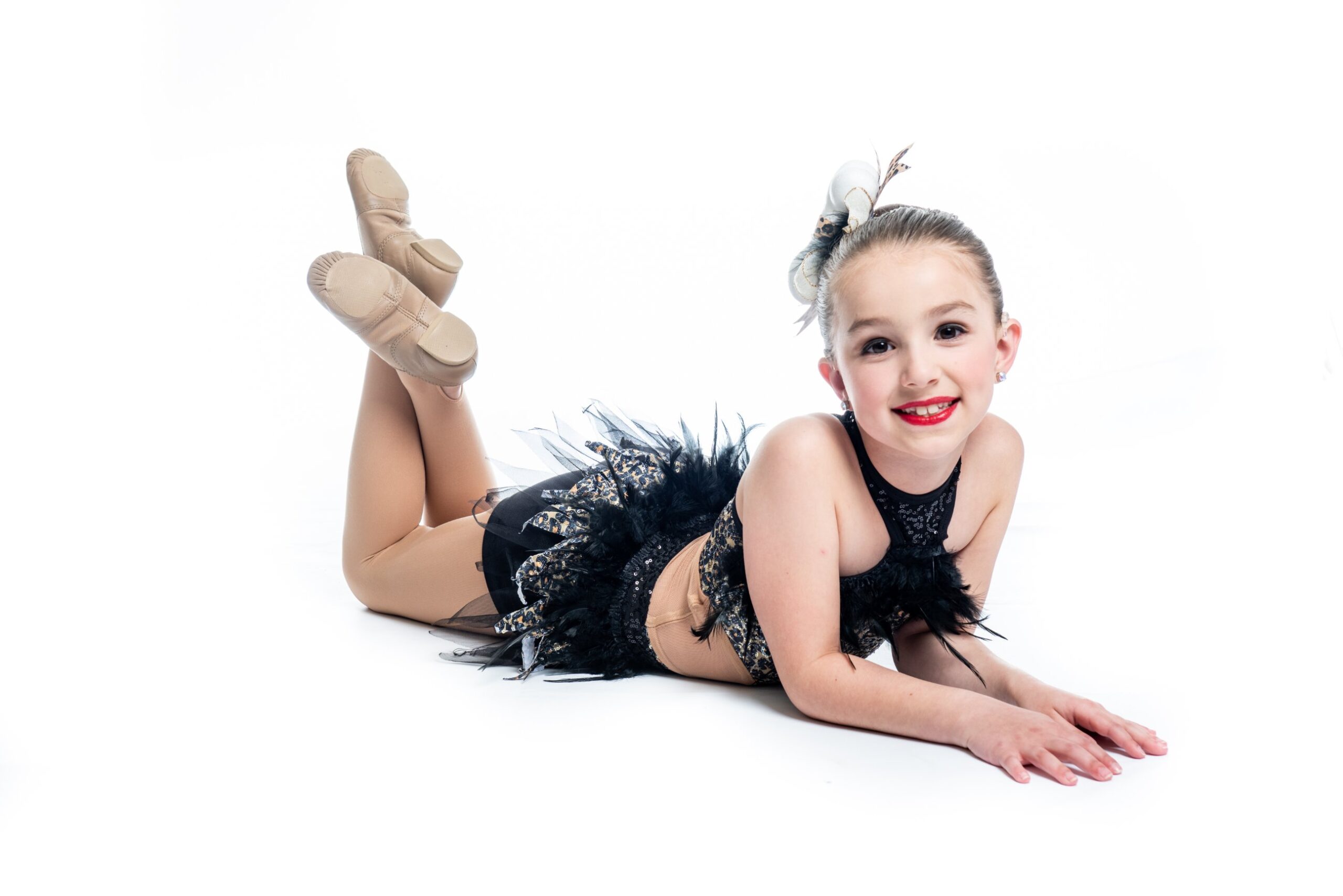 Young dancer posing with bright smile