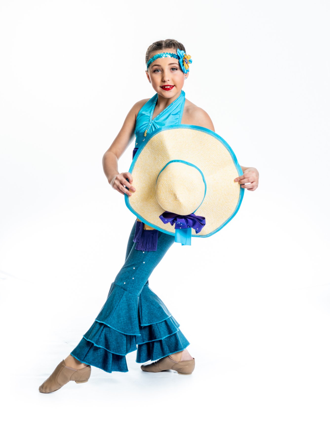 Young dancer with large straw hat