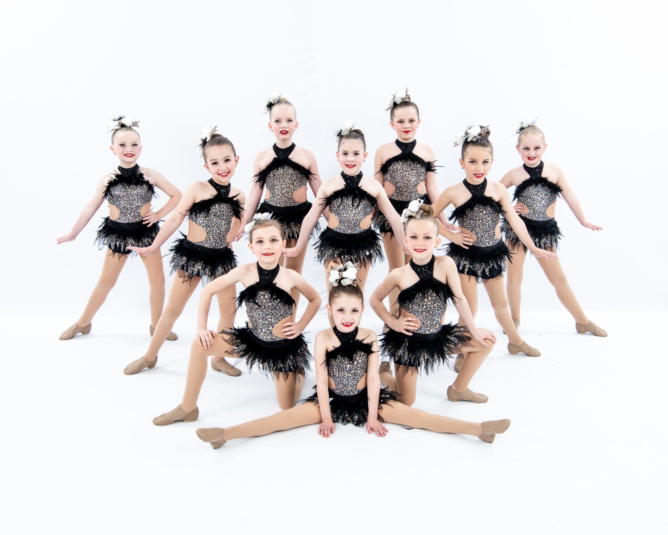 Dance group in matching black outfits