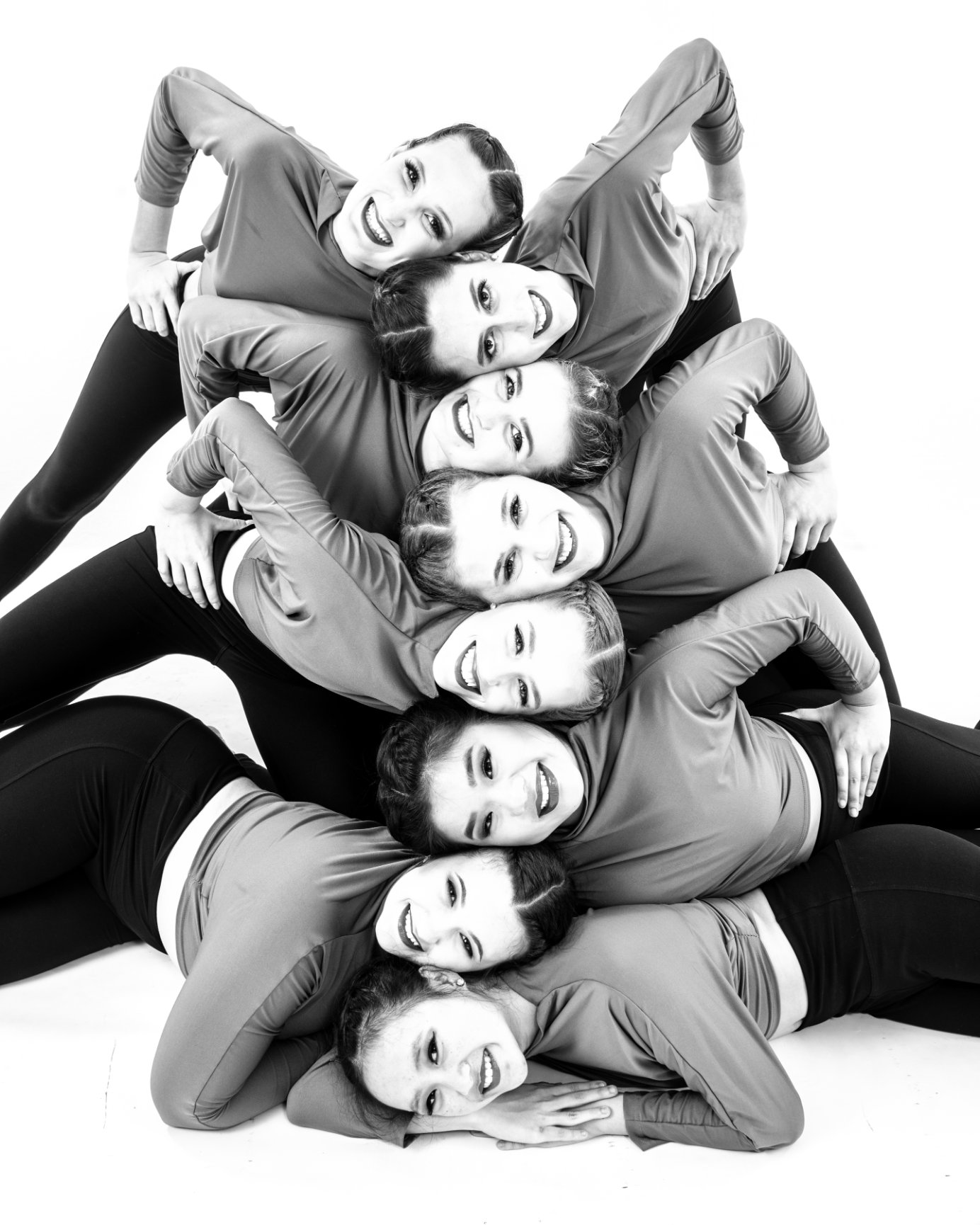 Group of dancers in a stacked formation