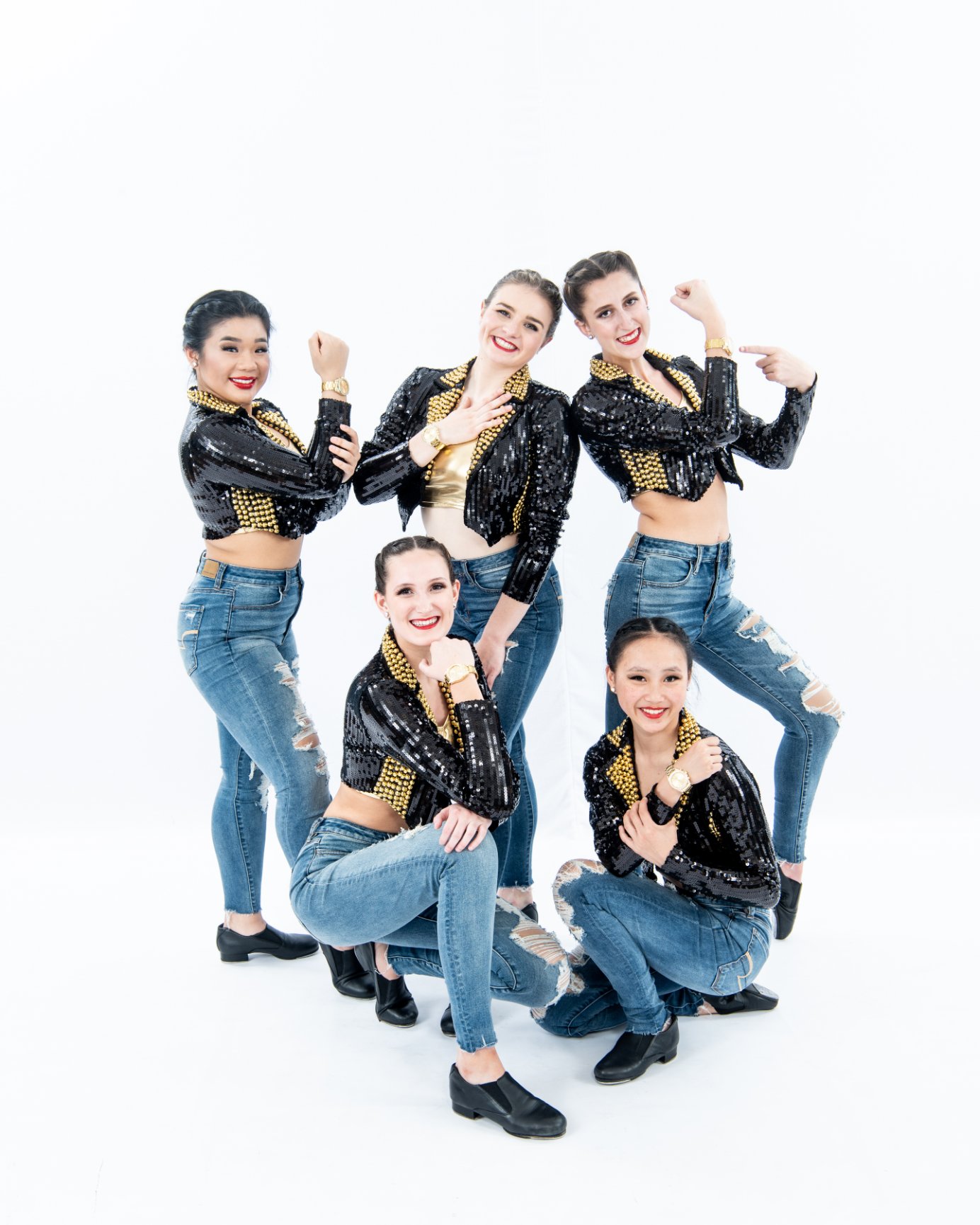 Dancers in matching outfits and jeans