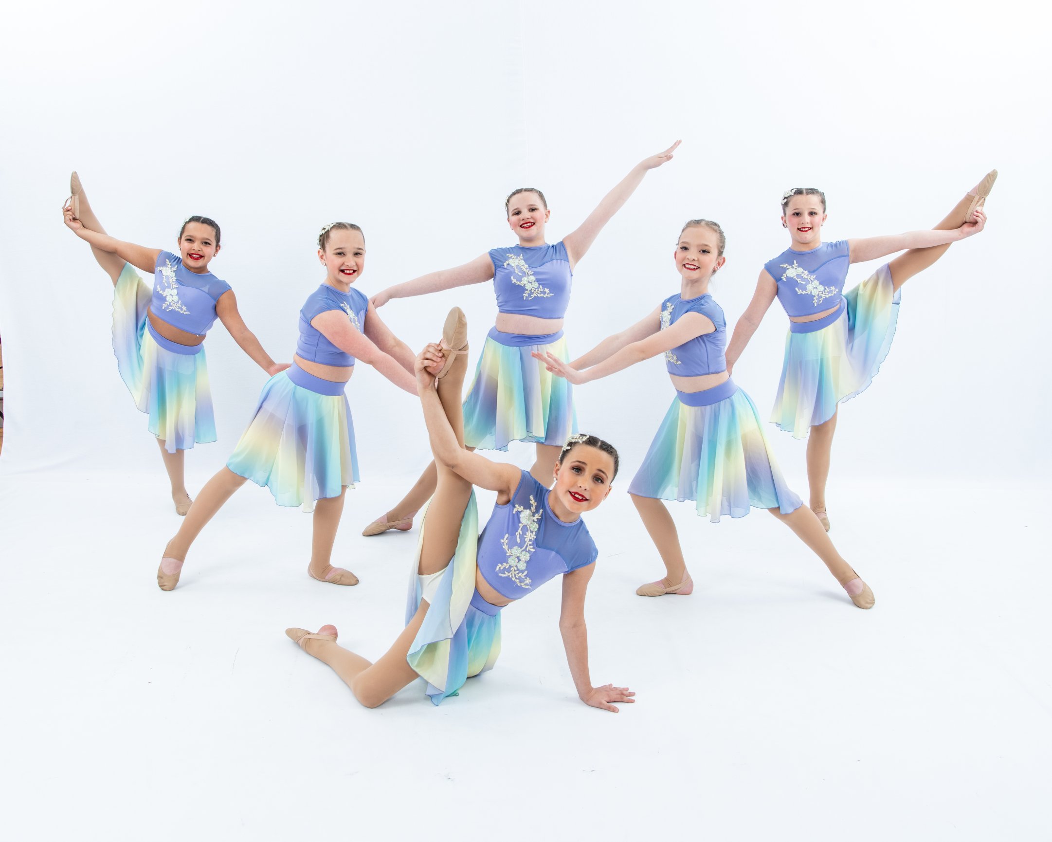Dance group in colorful costumes posing