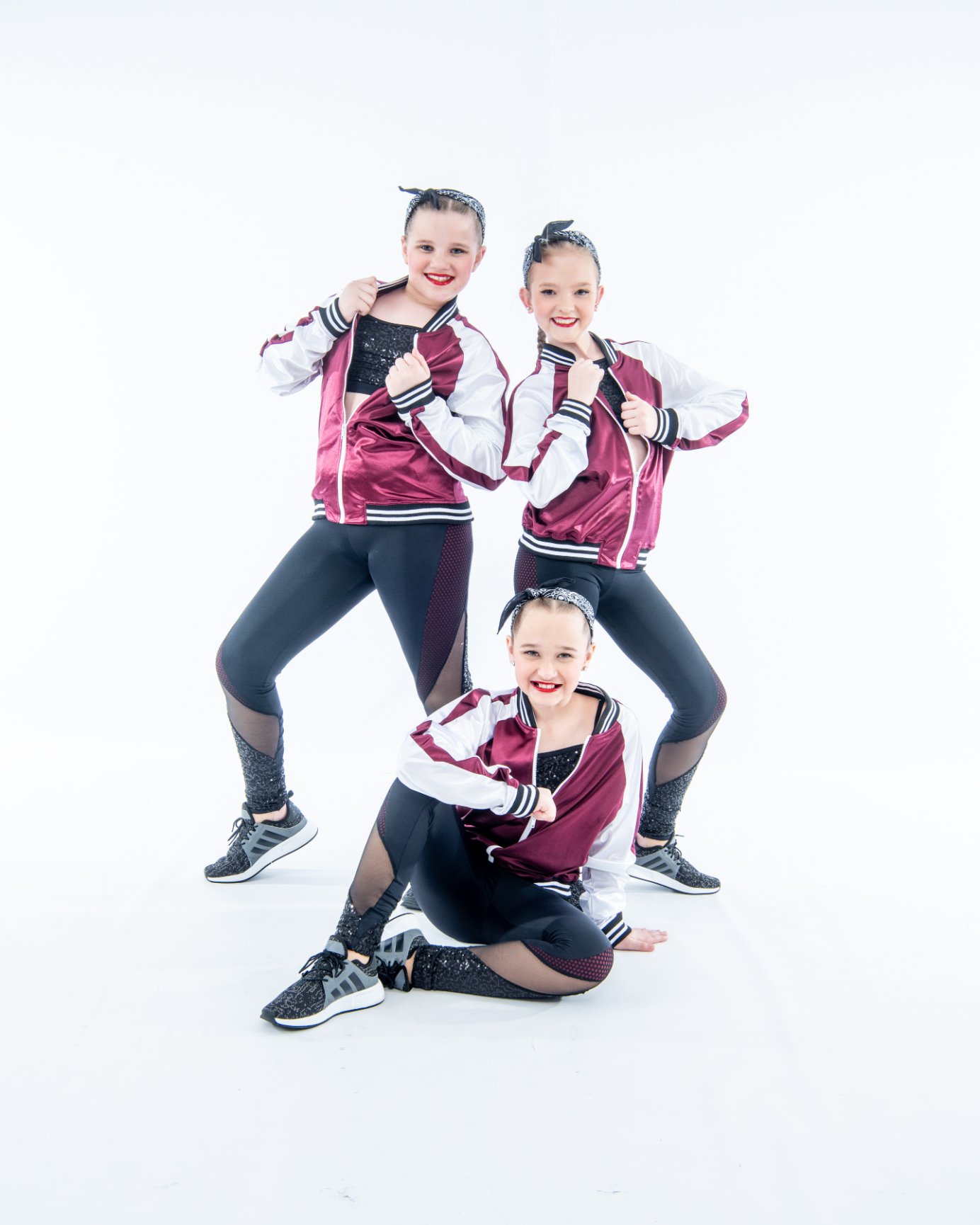 Dance trio posing confidently