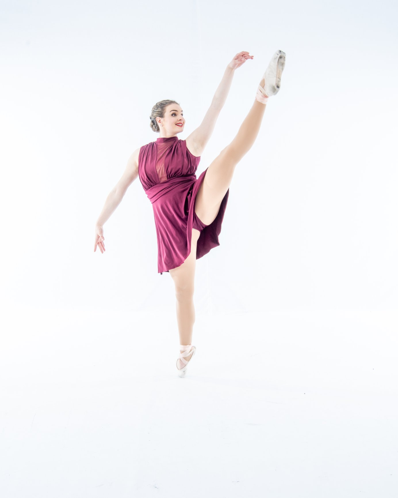 Elegant ballet pose in studio setting
