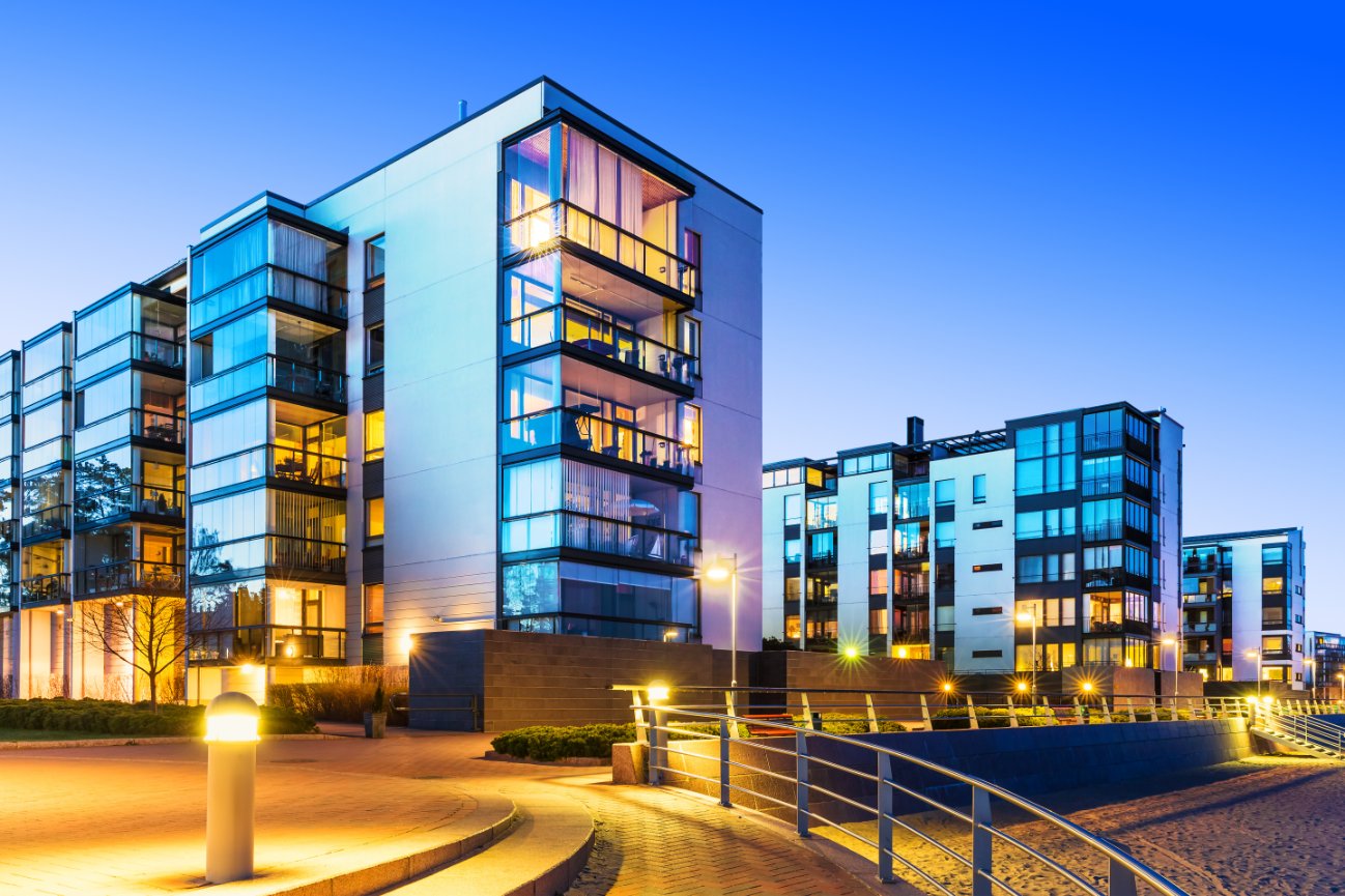 Illuminated glass buildings in evening light