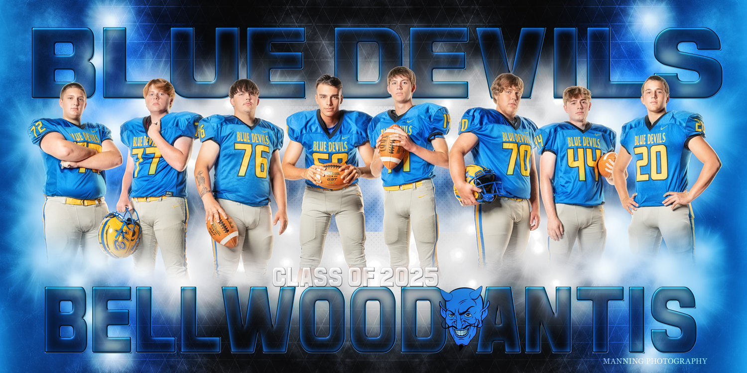 Football team posing in blue uniforms