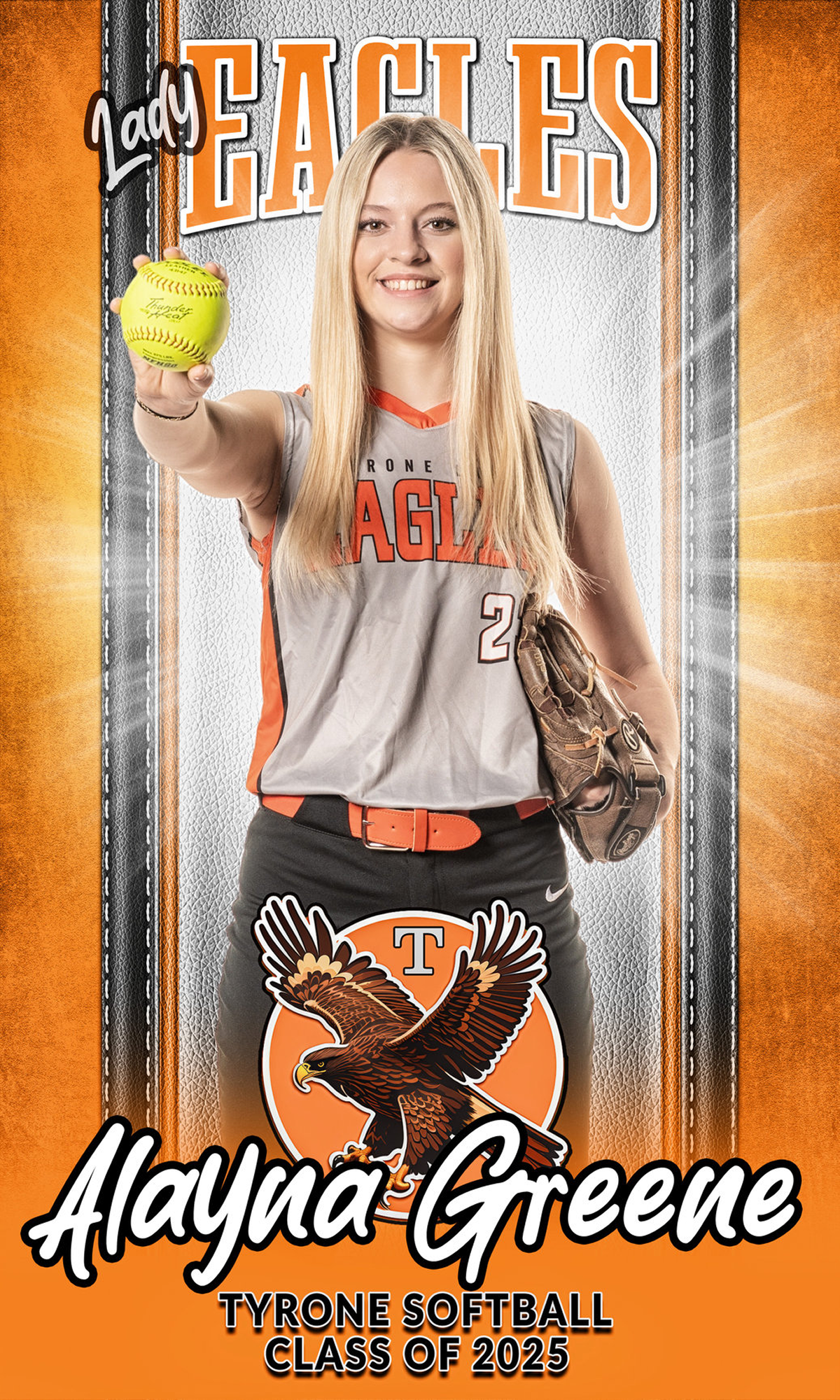 Young softball player posing with ball