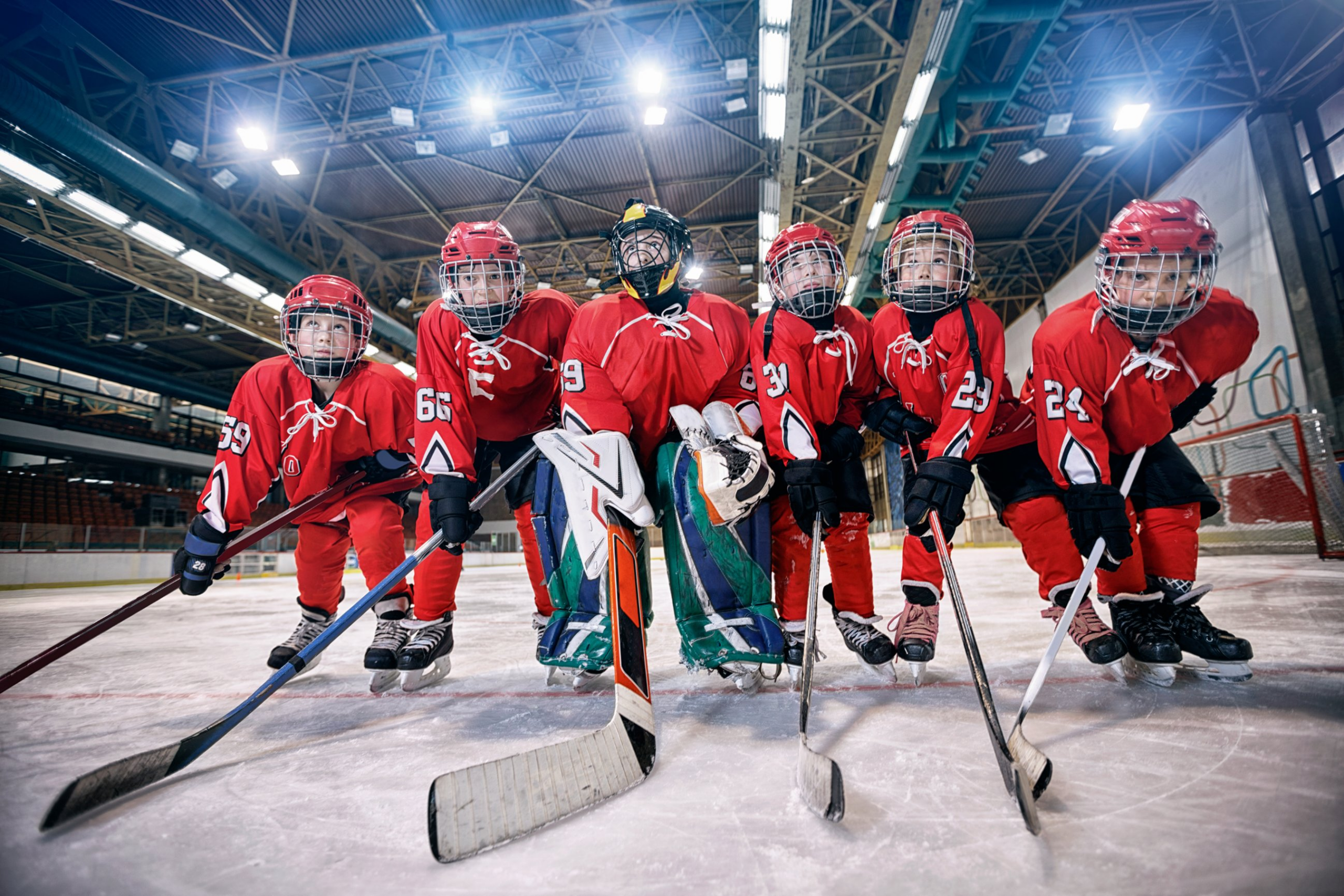 Kids in red hockey uniforms